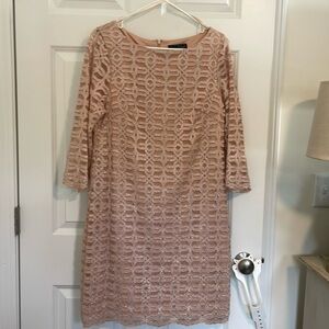 Pretty peach colored dress.